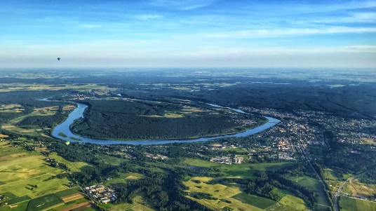 An_aerial_photo_of_the_town_of_Prienai_and_river_Nemunas_from_a_hot-air_balloon.